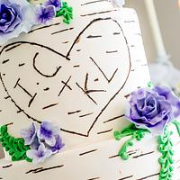 Birch wedding cake with violet roses 