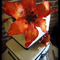 Burnt orange lily wedding cake