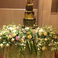 Black and gold birthday cake 
