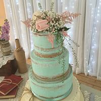 Semi naked teal buttercream with sugarpaste ruffles 