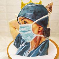 Handpainted female doctor cake