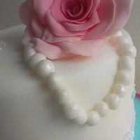 Rose, butterfly and pearls.