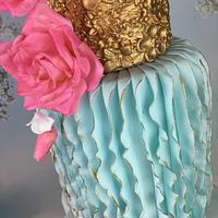 Vertical ruffles, pink roses and gold  wedding cake 
