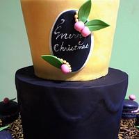 Black and gold Christmas cake and macarons