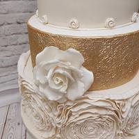 Ivory and gold wedding cake