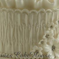 romantic cake with smock fabric and ruffles