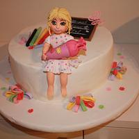 school cake with girl fondant topper
