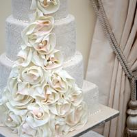 wedding dress cake with blush pink accents and pearls