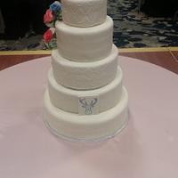 Wedding cake with flowers and a deer