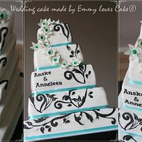 White wedding cake with turqouise and black details