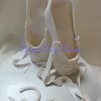 Silver and white ballet slippers and horse.