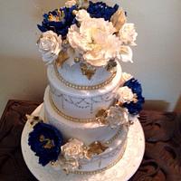 Royal Blue, gold n White 4 tier wedding cake