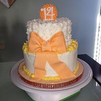 White and orange 14 th cake