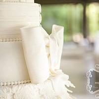 White wedding cake with bow