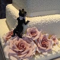 Ivory and dusky pink rose wedding cake with dog and cat
