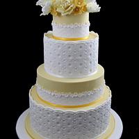 yellow wedding cake with tulips, roses and hydrangea