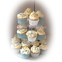 Baby boy christening with cupcakes