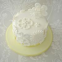 White cut out flower cake