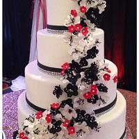 Black, red, and white wedding cake