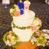 Wedding cake structure with handmade groom and the bride