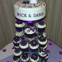 Purple flower wedding cupcakes and cake