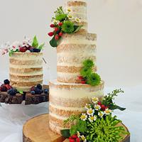 Naked wedding cake with cupcakes