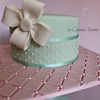 Polka dot cake with fondant bow and quilted cake board