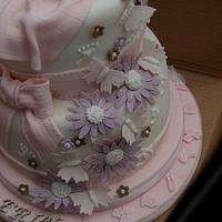 Butterflies and daisies christening cake with figures