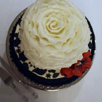 Wedding cake in black, ivory, and red.
