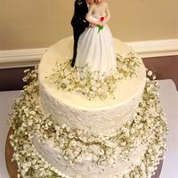 White lace wedding cake with gypsophilia 