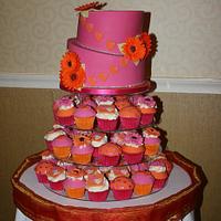 Hot pink topsy turvy wedding cake with hand made sugar gerbera's and hearts