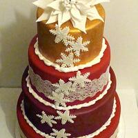 Red, Burgundy, Gold Christmas cake with white Ponsettia flower