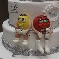 M&M Wedding Cake  all edible with bridal party professions