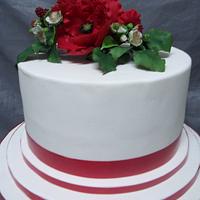 Poppy and blackberry wedding cake