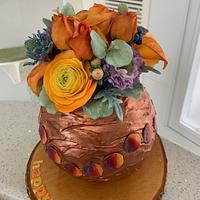 vase cake with flowers