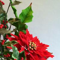 Sugar poinsettia and holly leaves