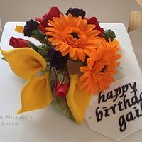 Bright sugar flowers birthday cake