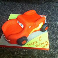 Car Cake in the style of Lightning McQueen