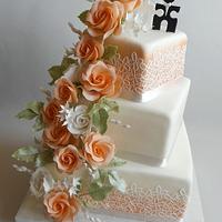 Wedding cake with orange roses