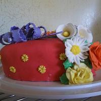sweetheart cake, covered in mm fondant with gumpaste flowers and bow.