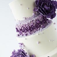 Purple ombre beaded wedding cake
