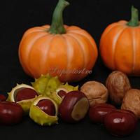 Autumn sugar flowers, pumpkins and nuts composition