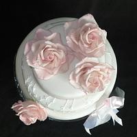 WEDDING CAKE WITH ROSES AND a copy of wedding invitations decor