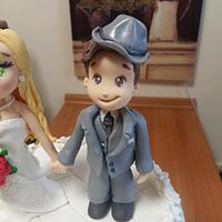 Wedding cake with figures and roses