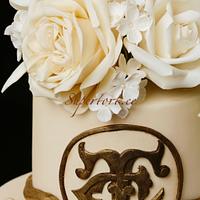 Classic style ivory and gold wedding cake