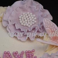 Ruffle cake with ruffle flowers, pearls & butterflies