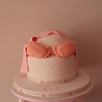 Baby rump cake with cupcakes on a bespoke stand 