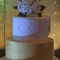 Wedding cake with a bouquet of jasmine flower