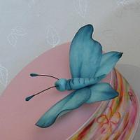 Painted cake with a butterfly