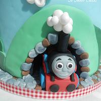 Thomas the Tank Engine cake with a sculpted cloud..